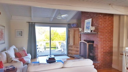 Madaket Nantucket vacation rental - 2nd level living room vaulted ceiling and fireplace and deck