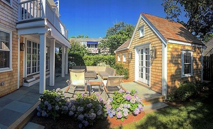 Nantucket town Nantucket vacation rental - Backyard living area includes sectional, gas fire table & awning.