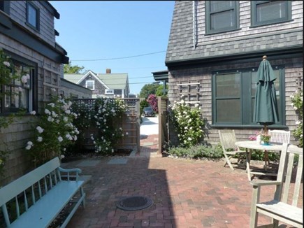 Siasconset Nantucket vacation rental - Back patio w/ grill and outside shower, w/ a larger picnic table