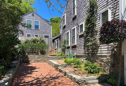 Nantucket town, Nantucket Nantucket vacation rental - Parking for SUV and bicycles. Cocktail terrace behind shrubbery.