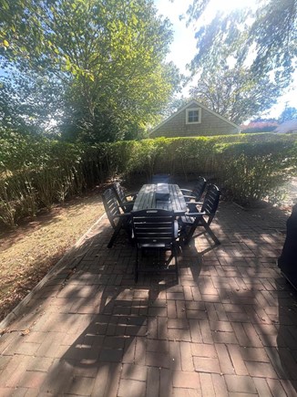 Monomoy Village Nantucket vacation rental - Outdoor dining space with Weber gas grill and fire feature