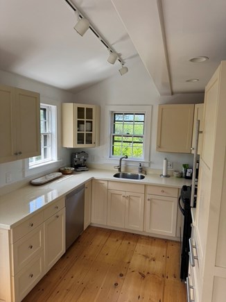 Madaket Nantucket vacation rental - Kitchen with all new plates, Global knives and steak knives.